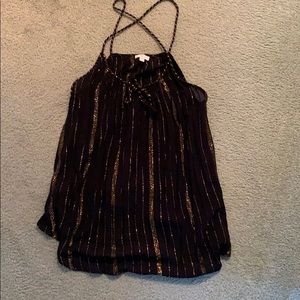 Back and gold tank with cross cross straps